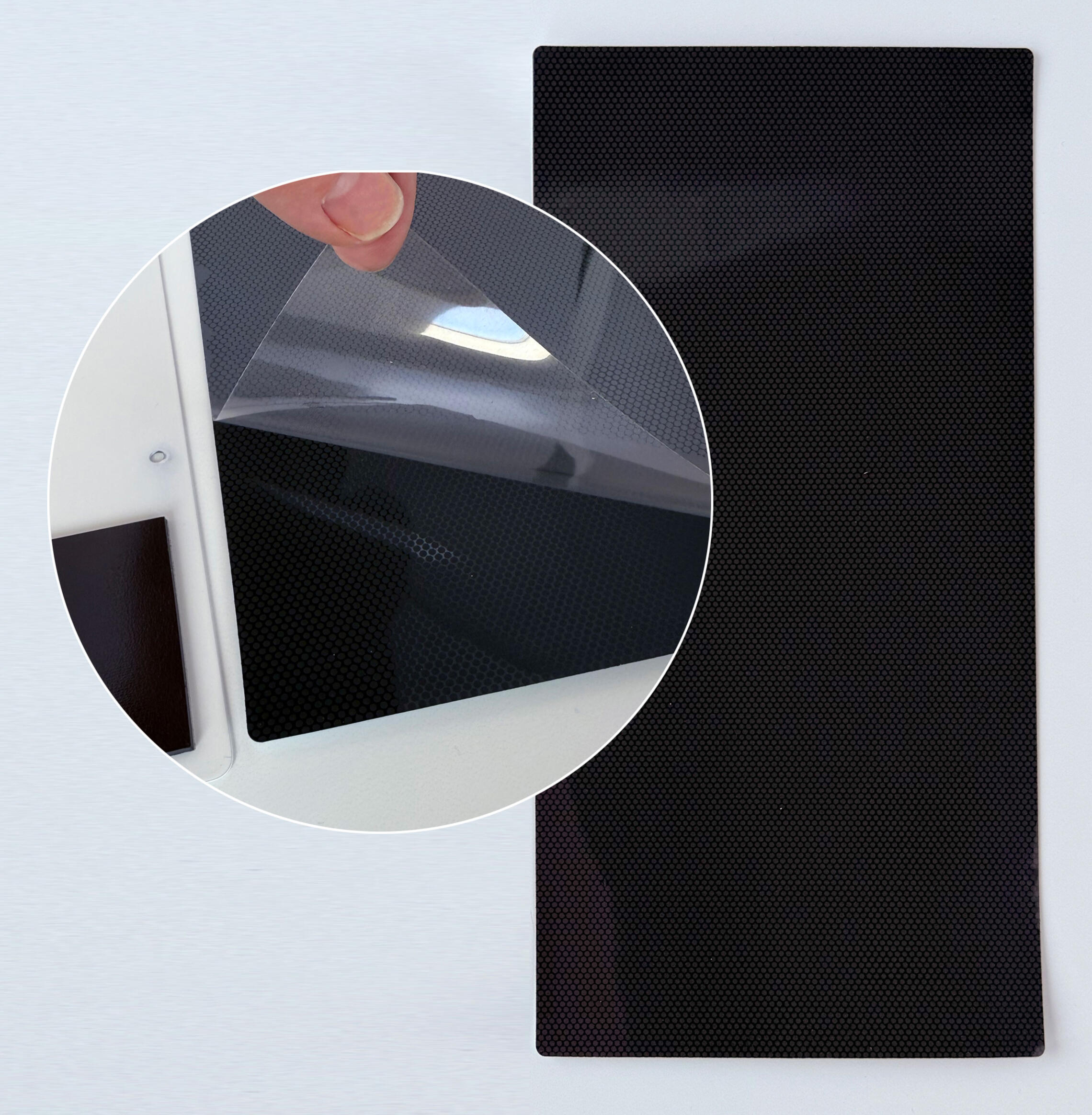 Mighty and Bright's Flex Magnetic Chart, shown face-down with the plastic backing lifted to expose the material underneath